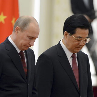 Valdimir Poutine et Hu Jintao sont unis dans leur position face au dossier syrien. [Mark Ralston]