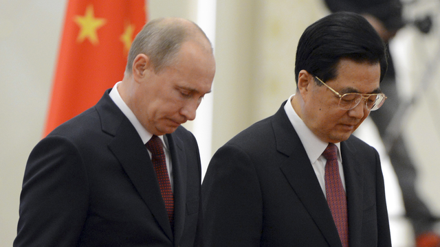 Valdimir Poutine et Hu Jintao sont unis dans leur position face au dossier syrien. [Mark Ralston]