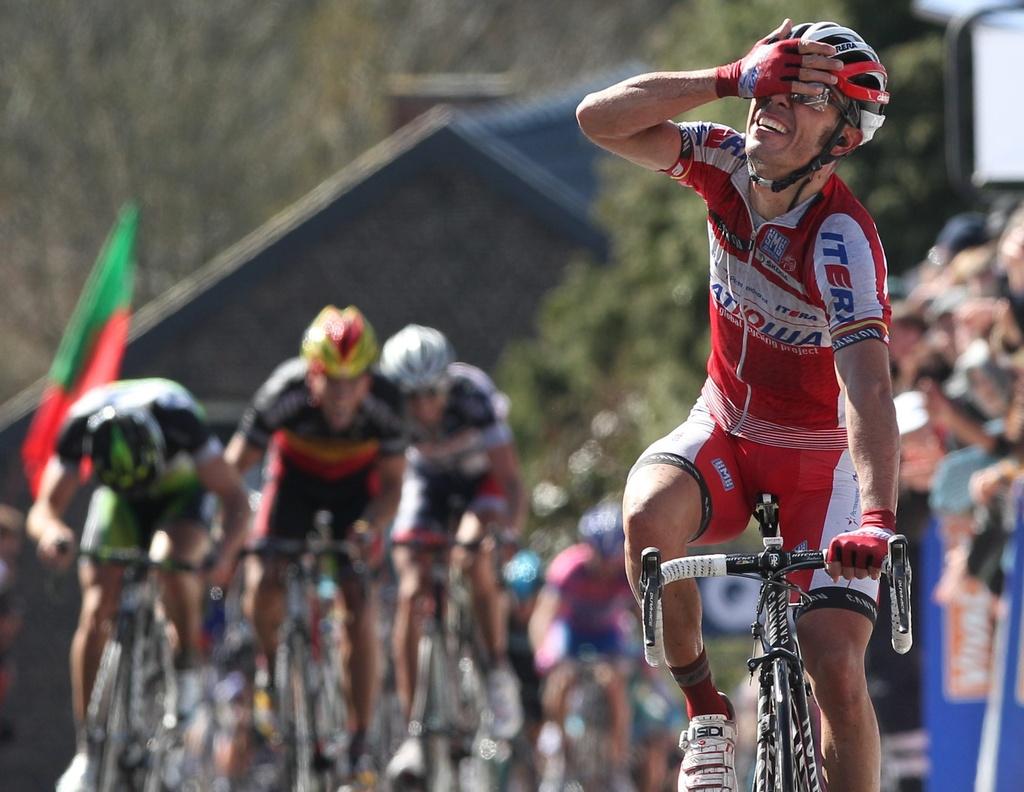 Spain's Joaquim Rodriguez Oliver of the Katusha team gestures as he wins the Belgian cycling classic Walloon Arrow/Fleche Walonne, in Huy, Belgium, Wednesday, April 18, 2012. Swiss cyclist Michael Albasini of the Greenedge Cycling team became second, Belgium's Philippe Gilbert of the BMC Racing team was third. (AP Photo/Yves Logghe) [Yves Logghe]
