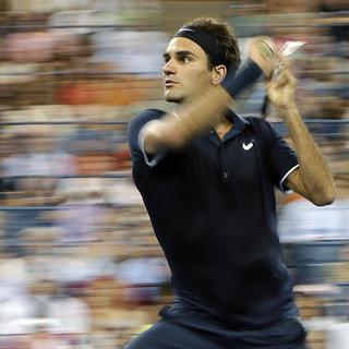 Roger Federer durant son match contre l'Allemand Björn Phau au deuxième tour de l'US Open 2012. [Darron Cummings]