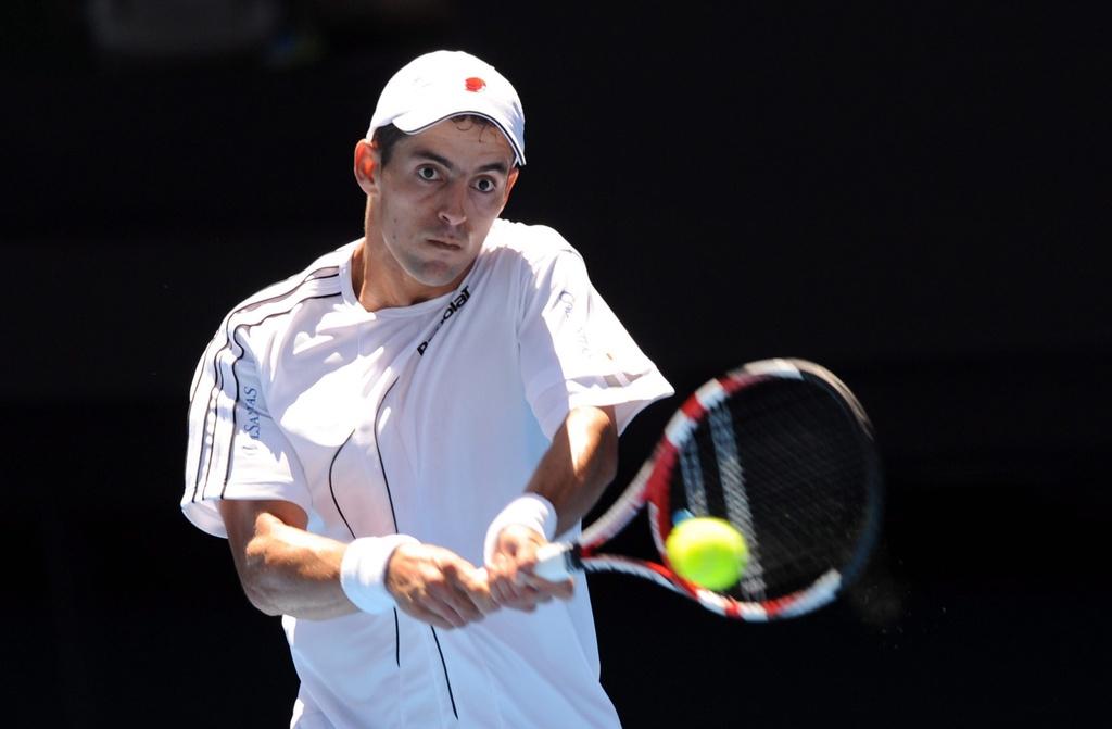 epa03066403 Colombia's Santiago Giraldo in action during his second round match against world number one, Serbia's Novak Djokovic at the Australian Open tennis tournament in Melbourne, Australia, 19 January 2012. EPA/JOE CASTRO AUSTRALIA AND NEW ZEALAND OUT [Joe Castro]