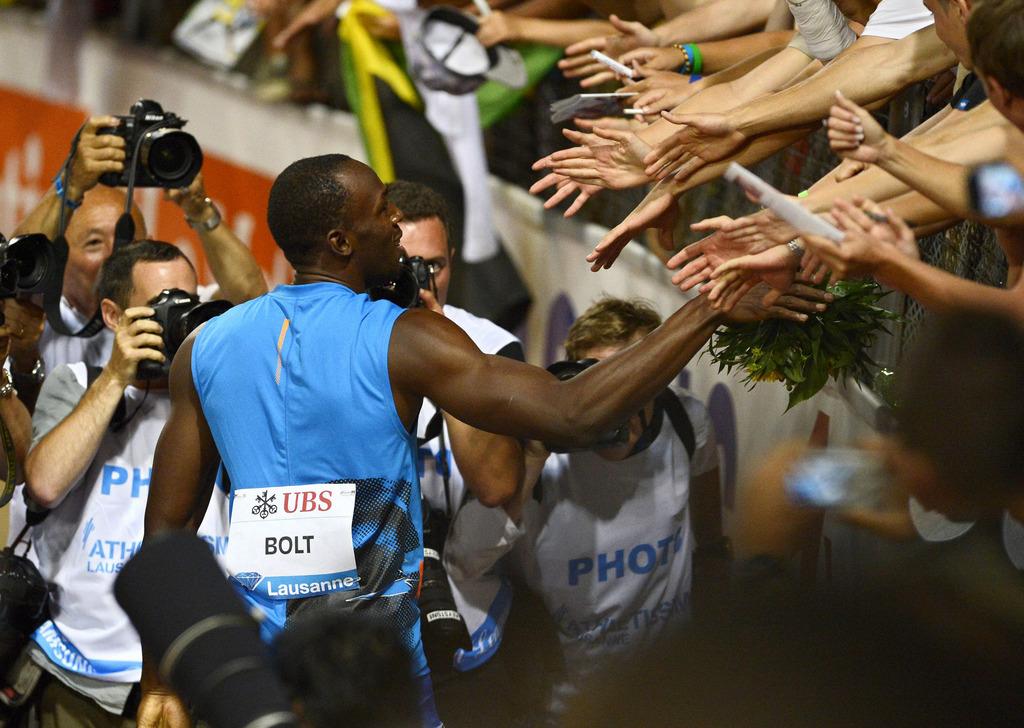 La "légende" Usain Bolt himself. Ou l'un des chouchous du public lausannois. [KEYSTONE - MAXIME SCHMID]