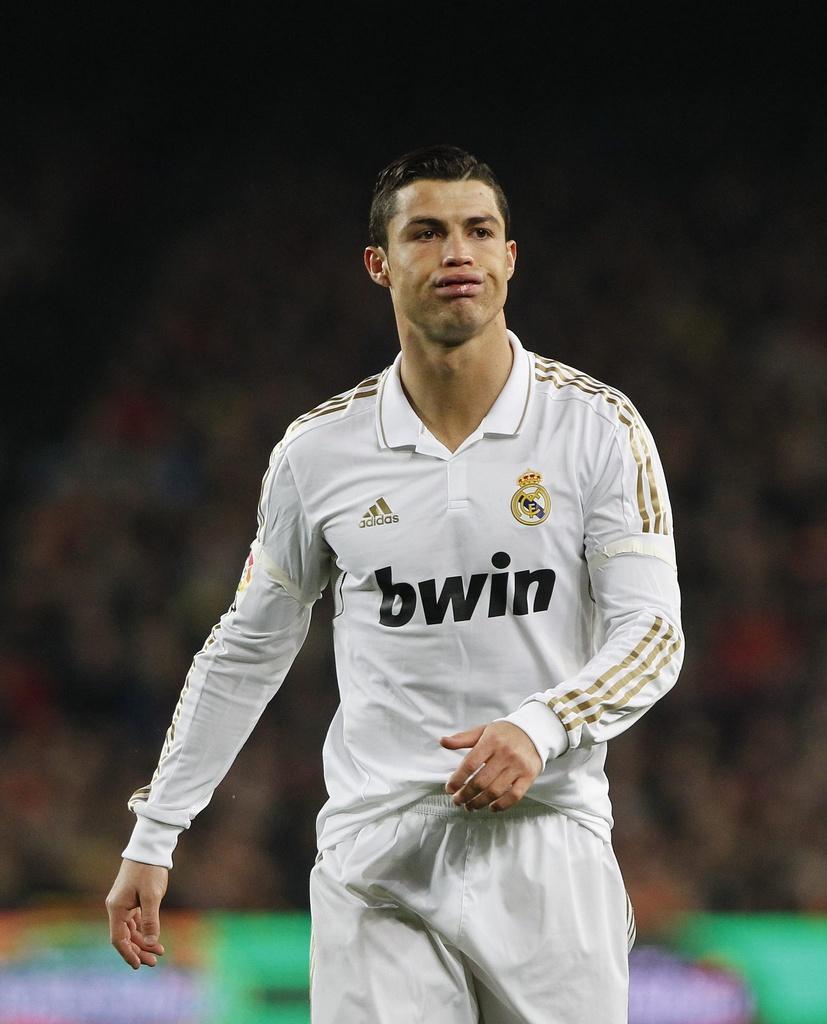 Real Madrid's Cristiano Ronaldo from Portugal reacts during their quarterfinals, second leg, Copa del Rey soccer match against FC Barcelona at the Camp Nou stadium in Barcelona, Spain, Wednesday, Jan. 25, 2012. (AP Photo/Andres Kudacki) [Andres Kudacki]