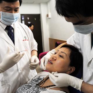 Chirurgie plastique en Chine à Guangzhou [Imaginechina/AFP - Qiao Junwei]