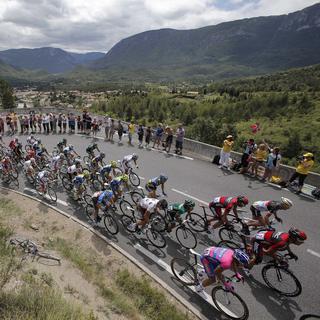 The pack climbs Portel pass during the 14th stage of the Tour de France cycling race over 191 kilometers (118.7 miles) with start in Limoux and finish in Foix, France, Sunday July 15, 2012. (AP Photo/Christophe Ena) [Christophe Ena]