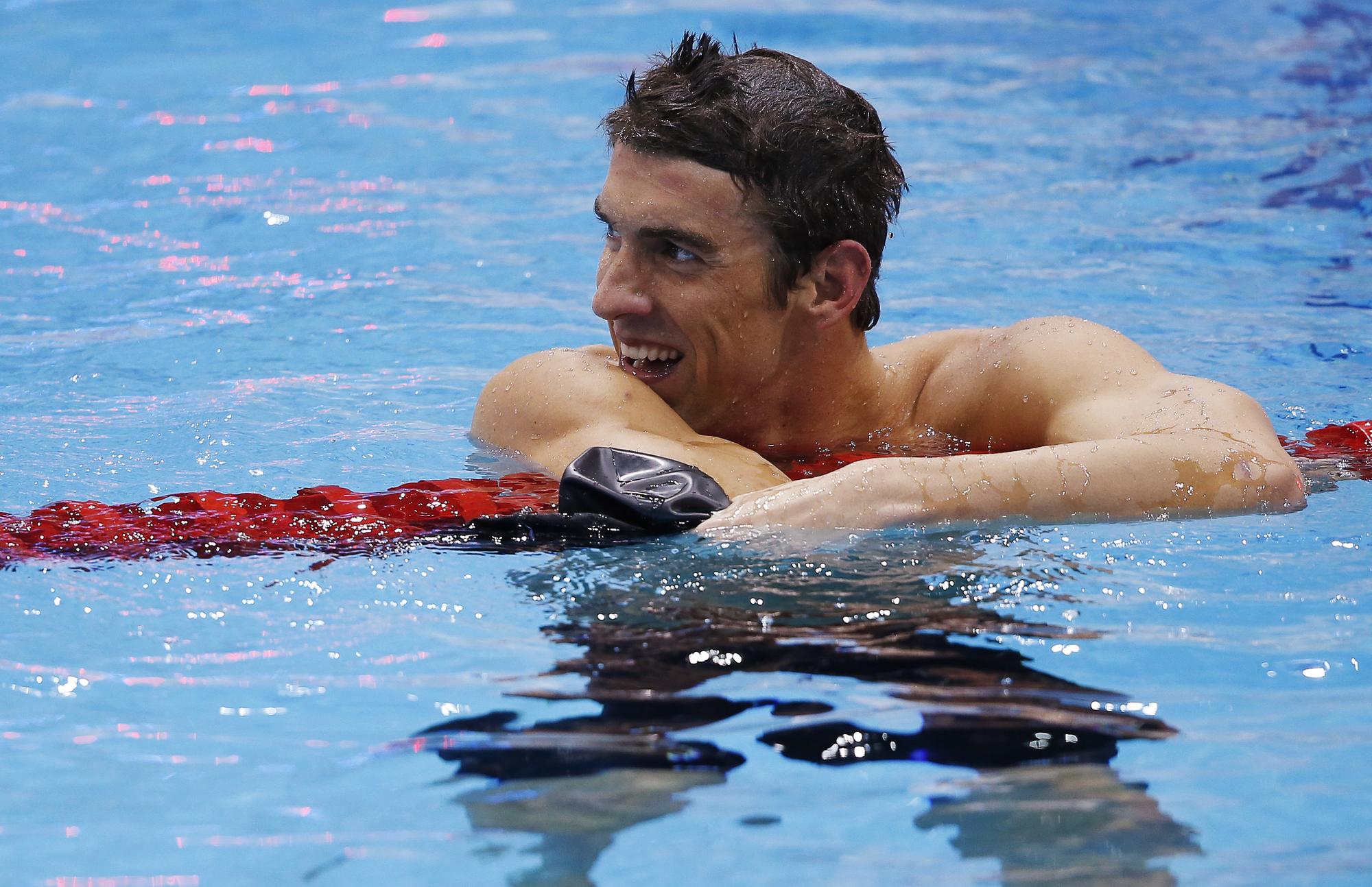 Pas encore rassasié, Phelps était déjà de retour dans l'eau quelques minutes après son sacre pour les demi-finales du 100m papillon. [Jorge Silva]