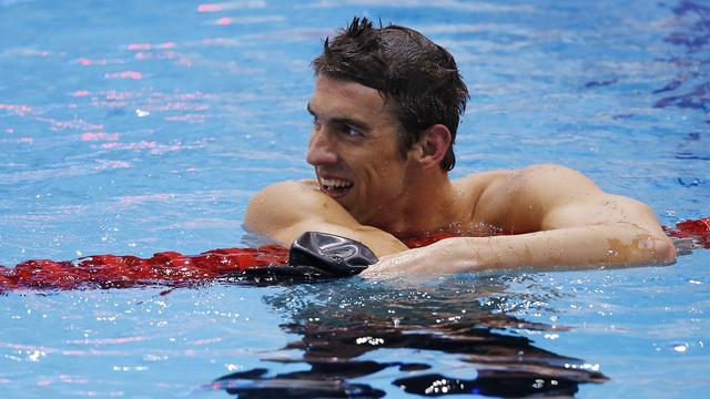 Pas encore rassasié, Phelps était déjà de retour dans l'eau quelques minutes après son sacre pour les demi-finales du 100m papillon. [Jorge Silva]
