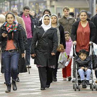 L'Allemagne est de plus en plus multiculturelle. En 2012, il y a notamment eu une hausse spectaculaire de l'immigration des pays du Sud. [Martin Meissner]