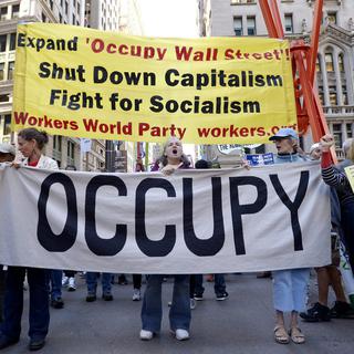 Le mouvement "Occupy Wall Street" révèlent les dessous des rachats de dettes aux USA. [EPA/Keystone - Justin Lane]