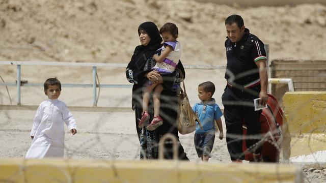 De plus en plus de réfugiés irakiens en Syrie reprennent le chemin du pays. [AP/Keystone - Karim Kadim]
