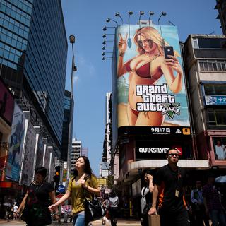 La sortie mondiale de Grand Theft Auto V est hyper médiatisée, comme ici à Hong Kong. [Philippe Lopez]