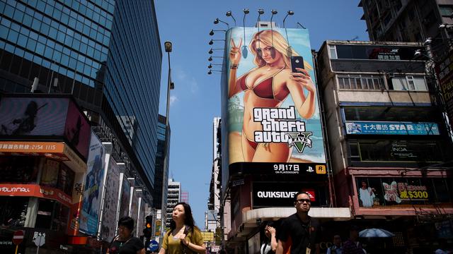 La sortie mondiale de Grand Theft Auto V est hyper médiatisée, comme ici à Hong Kong. [Philippe Lopez]