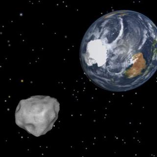 Illustration du passage de l'astéroïde 2012 DA14 près de la Terre. [EPA/Keystone - NASA/JPL-CALTECH]