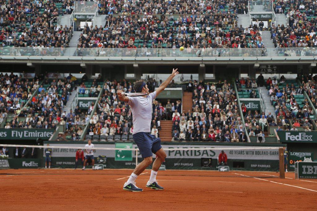 Federer doit se porter vers l'avant s'il entend reproduire sa performance de 2009, selon Guy Forget. [KEYSTONE - Petr David Josek]