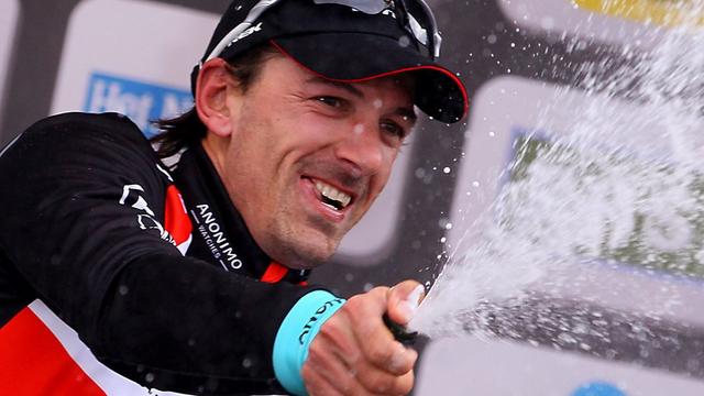 epa03646190 Swiss Fabian Cancellara of RadioShack-Leopard Team celebrates on the podium after winning the Ronde van Vlaanderen (Tour of Flanders) cycling race in Oudenaarde, Belgium, 31 March 2013. EPA/OLIVIER HOSLET [KEYSTONE - Oliver Hoslet]