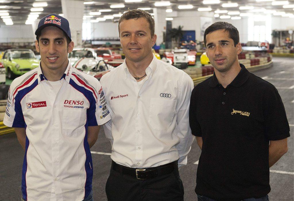 Sébastien Buemi (à gauche), Marcel Fässler (centre) et Neel Jani (à droite), les pilotes suisses aux 24 Heures du Mans. [Lukas Lehmann]