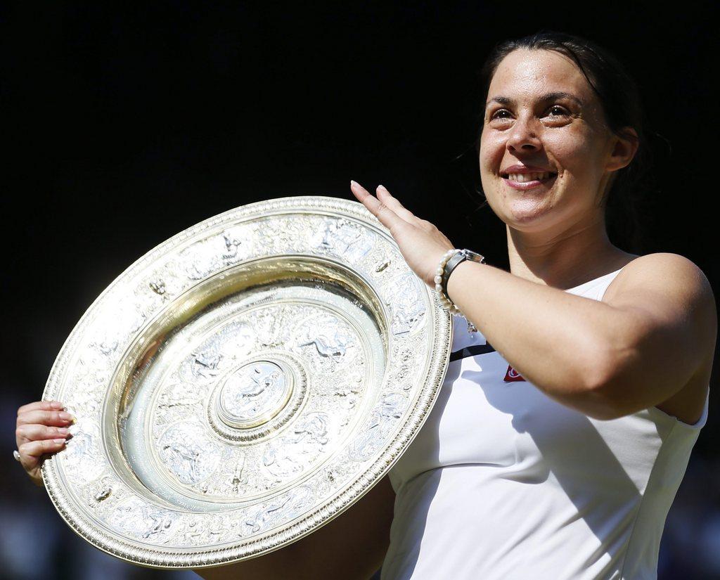 Marion Bartoli. Un sourire sur le visage et un soleil dans les mains. [Stefan Wermuth]