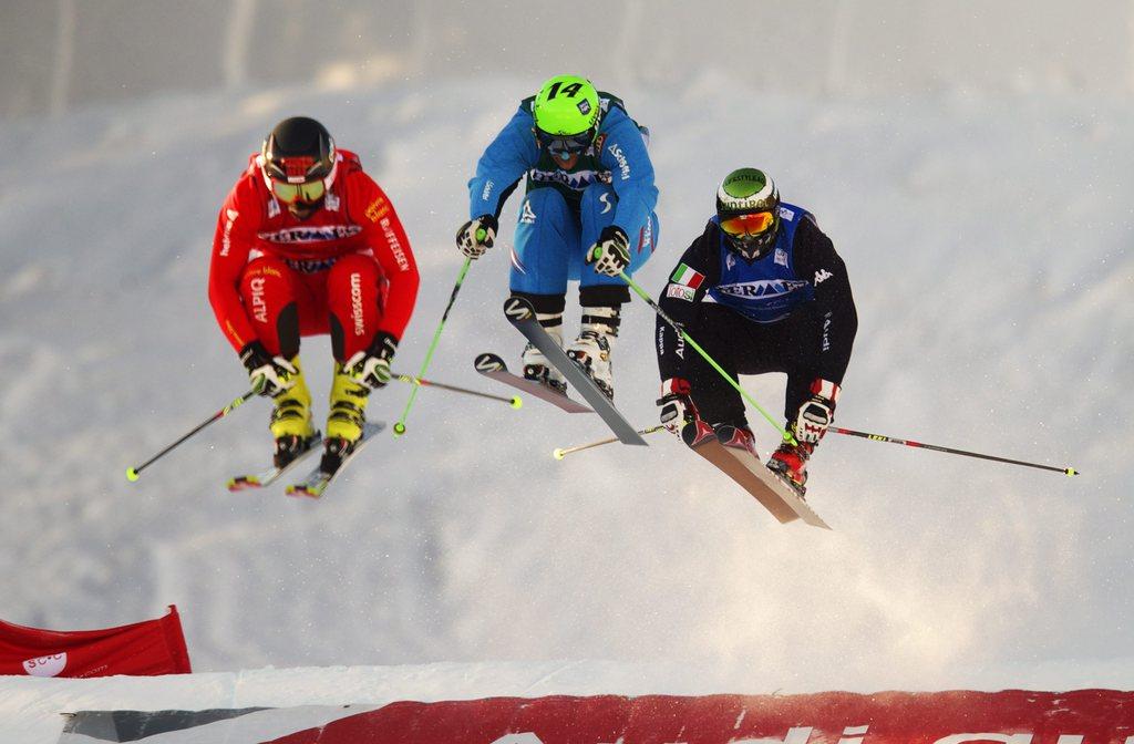 Armin Niederer (en rouge) a atteint à Nakiska son 8e podium en carrière. [Todd Korol]