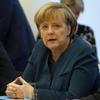 Angela Merkel doit faire des concessions pour trouver un accord de gouvernement avec le SPD. [AP Photo/Michael Sohn]