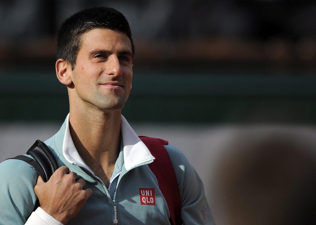 Novak Djokovic sourit. Il a lui aussi dû s'employer pour passer ce 1er tour. [KEYSTONE - Yoan Valat]