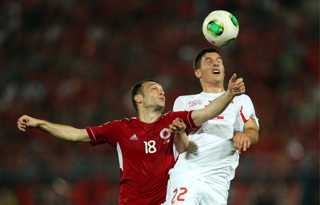 epa03906253 Albania's Hamdi Salihi (L) vies for the ball with Swiss Fabian Schar during the FIFA World Cup 2014 qualifying soccer match between Albania and Switzerland in Tirana, Albania, 11 October 2013. EPA/ARMANDO BABANI [KEYSTONE - Armando Babani]