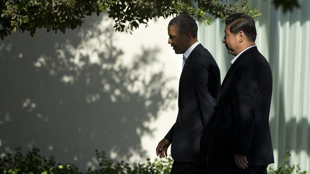 Le président américain Barack Obama, et le président chinois Xi Jinping. [AP Evan Vucci]
