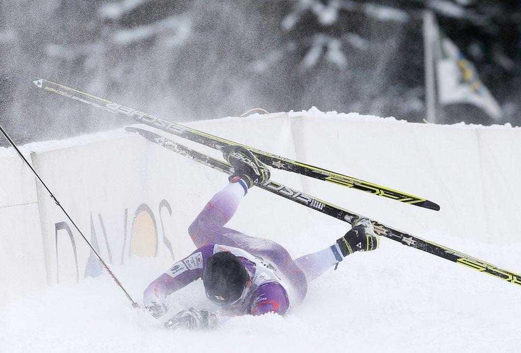 Hiroyuki Miyazawa from Japan falls down during the men's cross country classic style sprint qualification of the FIS World Cup in Davos, Switzerland, Saturday, February 16, 2013. (KEYSTONE/Arno Balzarini) [Arno Balzarini]