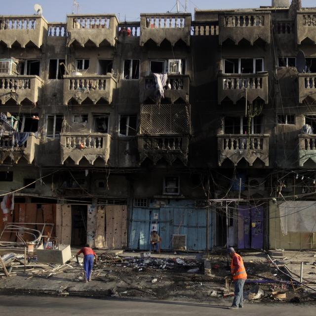 Une nouvelle vague d'attaques a fait 74 morts à Bagdad. [AP/Keystone - Karim Kadim]