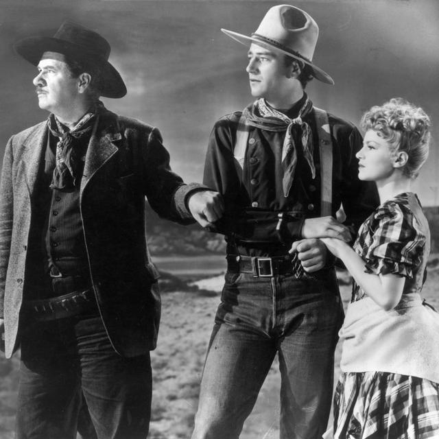 John Wayne, Claire Trevor et George Bancroft dans "La chevauchée fantastique" de John Ford. [Photo12]