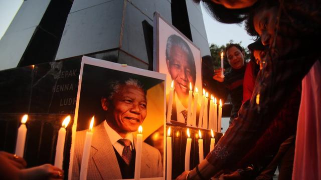 Une centaine de chefs d'Etat et de gouvernement étaient dans les tribunes du stade de Soweto à l'occasion de la cérémonie en hommage à Nelson Mandela. [EPA/Keystone - Raminder Pal Singh]