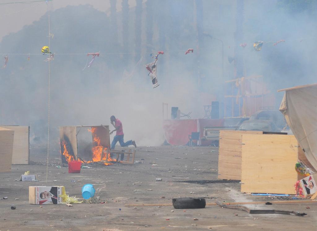 Les derniers protestataires ont été évacués de force. [KEYSTONE - Hussein Tallal]