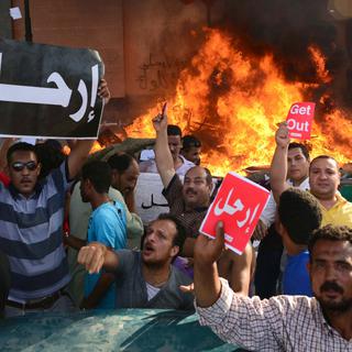 En juin 2013, pour l'anniversaire de l'élection de Mohamed Morsi, de nombreuses manifestations pro et anti-Morsi font plusieurs morts en Egypte. [AP Photo/Heba Khamis]