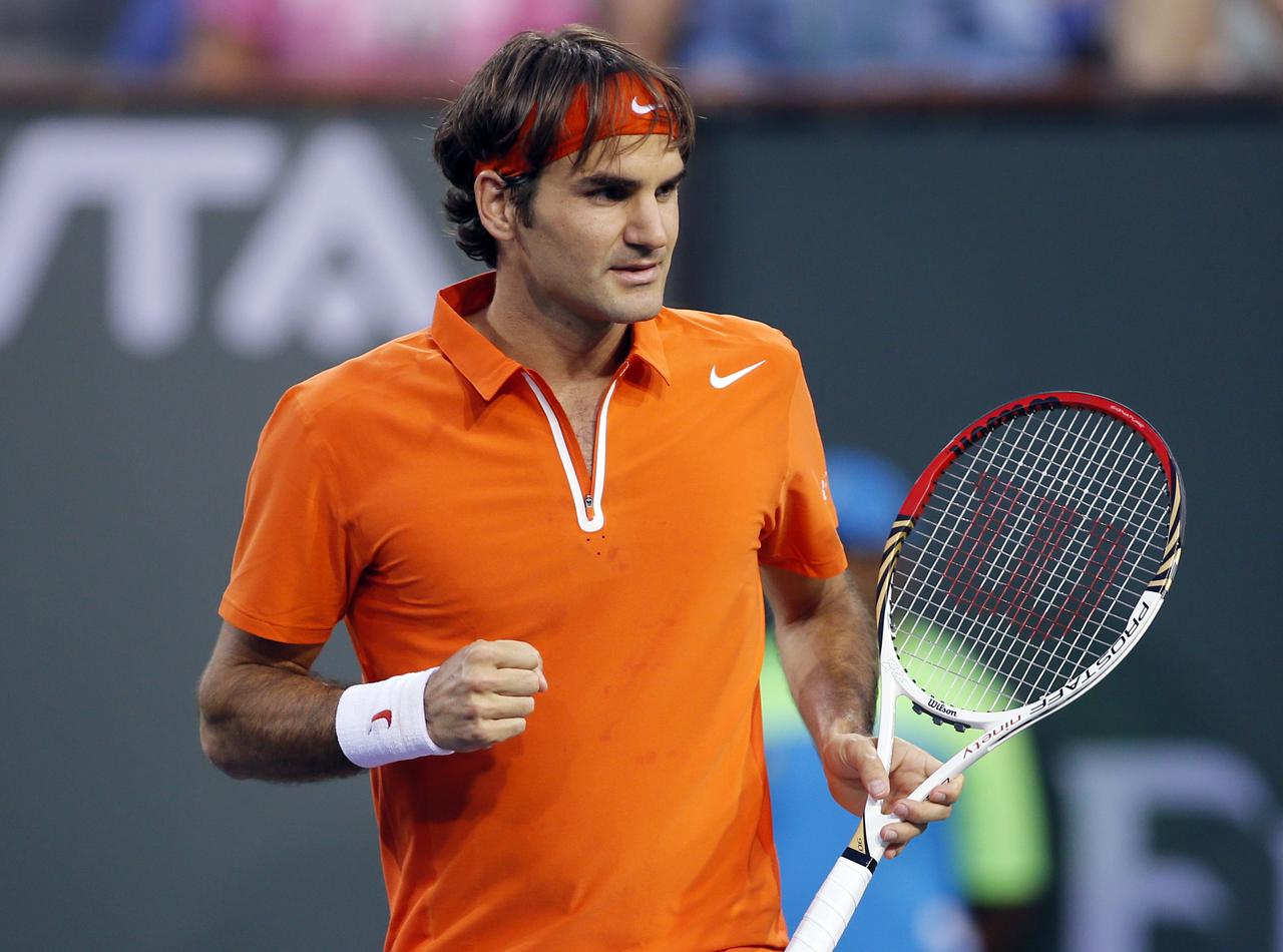 Roger Federer of Switzerland celebrates defeating compatriot Stanislas Wawrinka in their match at the BNP Paribas Open ATP tennis tournament in Indian Wells, California, March 13, 2013. REUTERS/Danny Moloshok (UNITED STATES - Tags: SPORT TENNIS) [REUTERS - Danny Moloshok]