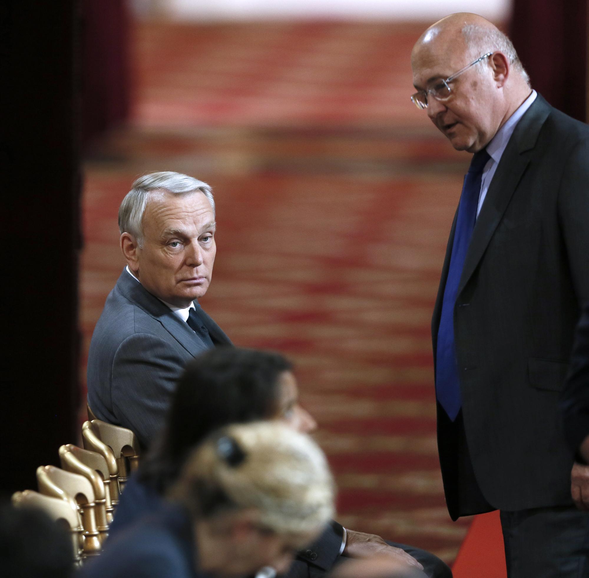 François Hollande a réaffirmé toute sa confiance à son Premier ministre Jean-Marc Ayrault (à gauche). [AFP - PATRICK KOVARIK]
