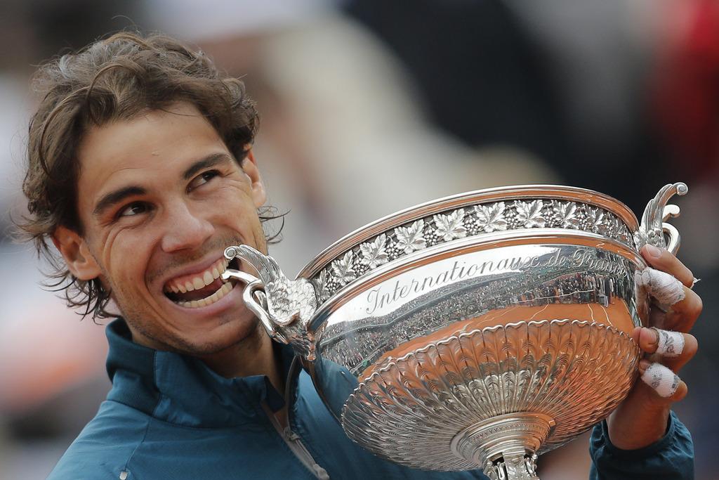 Rafael Nadal a remporté son 8e Roland-Garros, un record. [KEYSTONE - AP Photo/Christophe Ena]