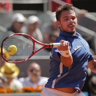 Stanislas Wawrinka from Switzerland returns the ball to Rafael Nadal from Spain during the men's final match at the Madrid Open tennis tournament, in Madrid, Sunday, May 12, 2013. (AP Photo/Andres Kudacki [Andres Kudacki / AP Photo]