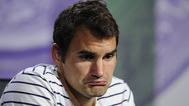 Roger Federer n'a pas caché sa déception après son élimination à Wimbledon. [AP Photo/AELTC, Thomas Lovelock]