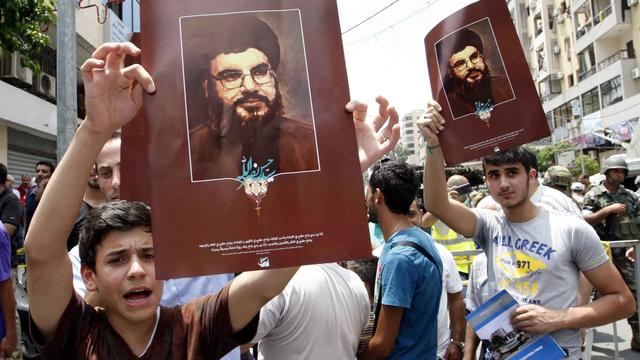 Les Libanais sont divisés entre pro et anti-Hezbollah. [Anadolu Agency/AFP - Bilal Jawich]