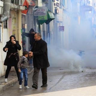 Après les violences de jeudi (ici à Tunis), ce vendredi est à haut risque en Tunisie. [AP/Keystone]