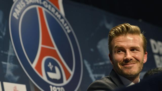 British soccer player David Backham, smiles during a press conference at the Parc des Princes stadium in Paris, Thursday, Jan. 31, 2013. David Beckham will join Paris Saint-Germain on Thursday, opting for a move to France after mulling over lucrative offers from around the world since leaving the Los Angeles Galaxy.(AP Photo/Benjamin Girette) [KEYSTONE - Benjamin Girette]