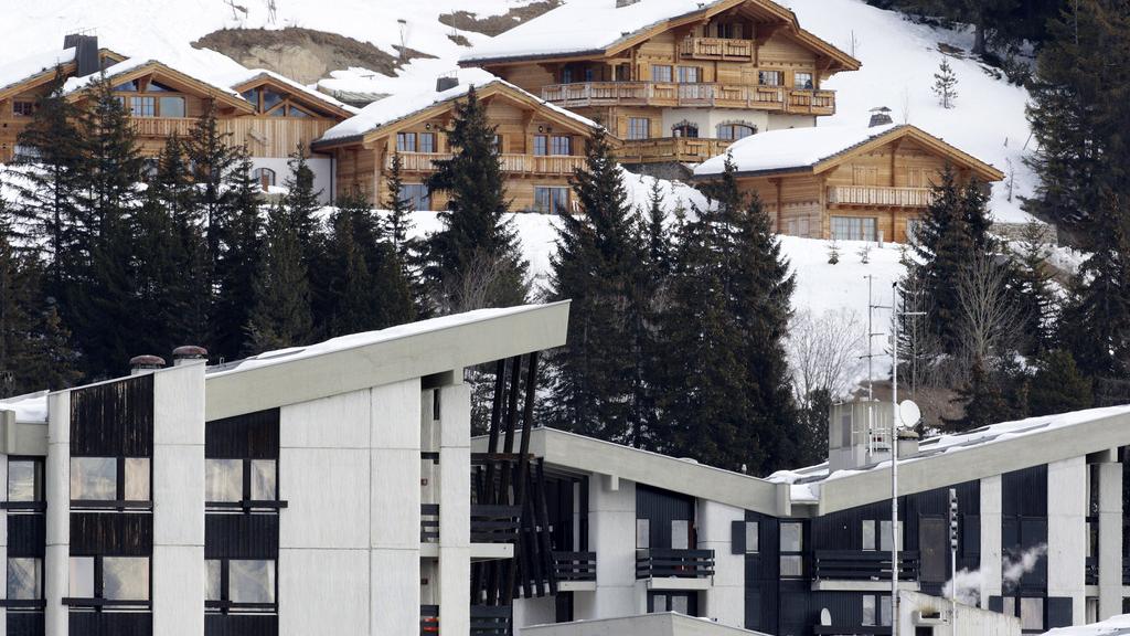 Les étrangers qui souhaitent acquérir un bien immobilier en Suisse resteront soumis à une autorisation. [Jean-Christophe Bott]