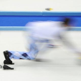 Curling. [Jean-Christophe Bott]