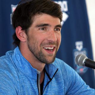 Pendant un peu plus d'un an, Phelps a voyagé, donné des conférences, beaucoup joué au golf et au poker. [Roy Dabner]