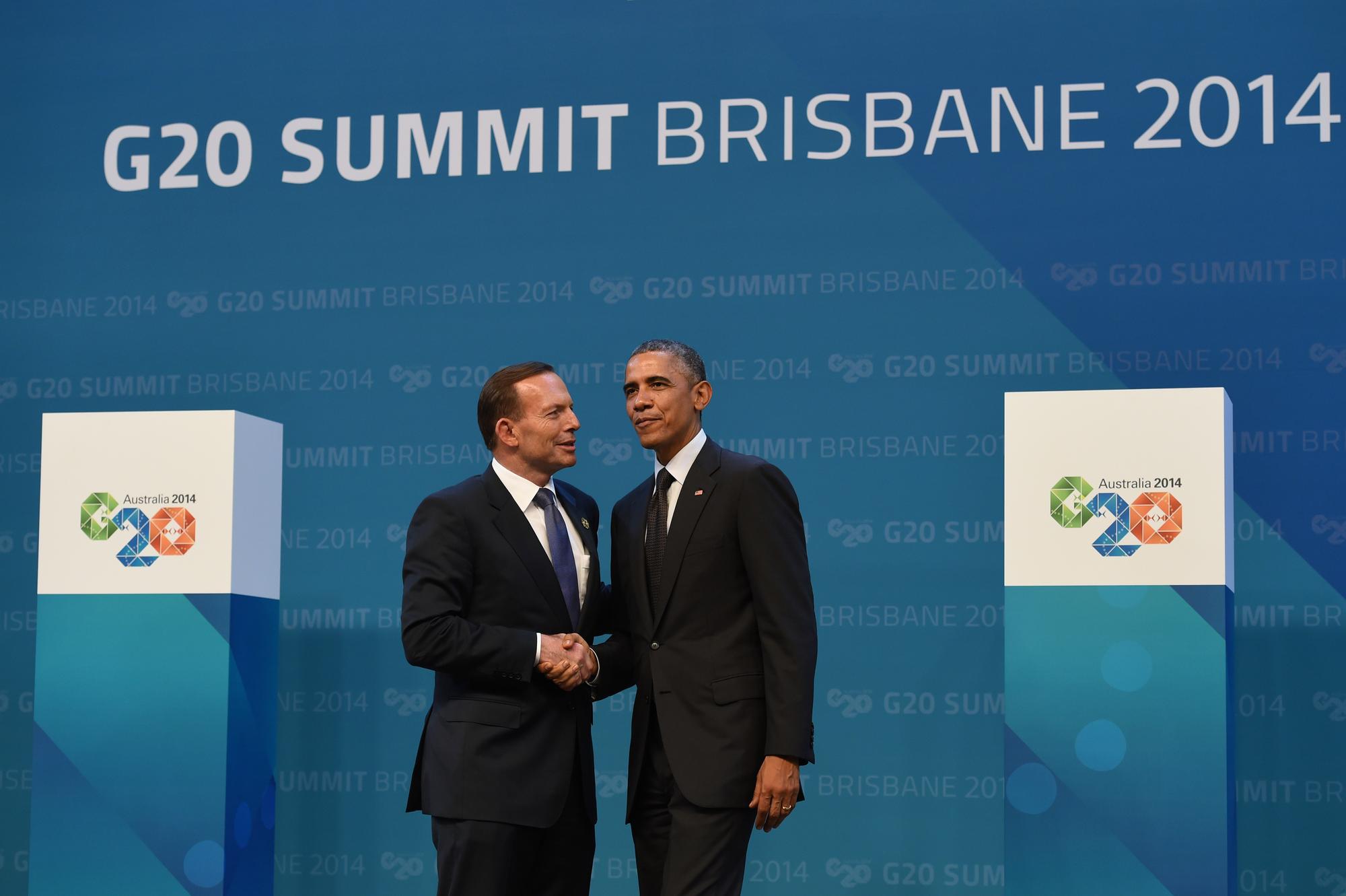 Le Premier ministre australien, à gauche, accueille le président américain Barack Obama à Brisbane. [AFP - William West]