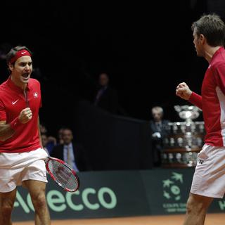 Roger Federer et Stanislas Wawrinka. [Christophe Ena - AP Photo]