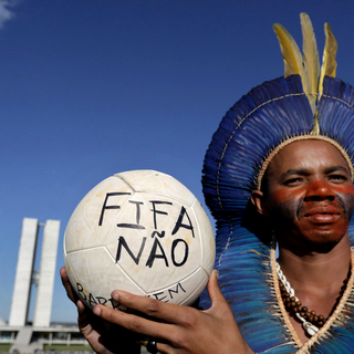 La FIFA est au coeur de toutes les critiques à quelques jours du Mondial. [AP/Keystone - Eraldo Peres]