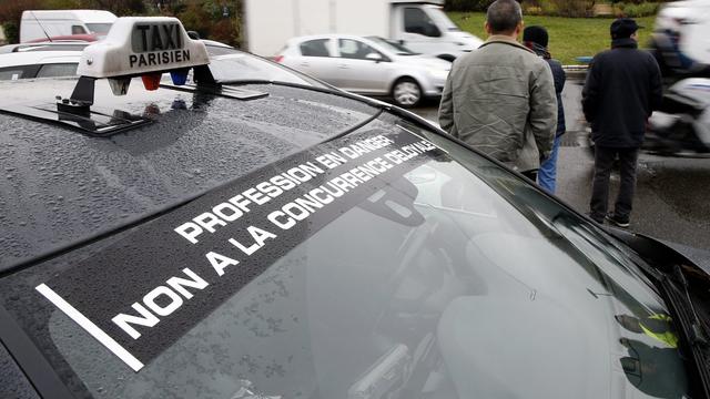 Uberpop sera interdit en France dès le 1er janvier. [EPA/Yoan Valat]