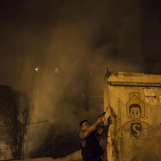 Les émeutes ont éclaté dans la favela de Pavao Pavazinho à Rio de Janeiro. [AP Photo - Felipe Dana]