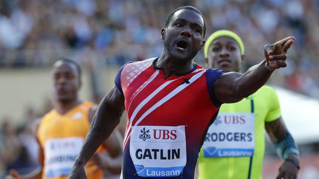 Gatlin a amélioré de deux centièmes le meilleur chrono 2014 de Richard Thompson. [Reuters - Denis Balibouse]