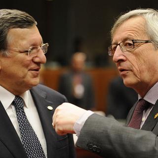 José Manuel Barroso cède la place à Jean-Claude Juncker. [AFP - John Thys]
